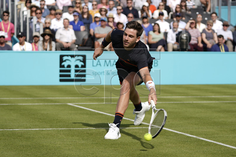 Britain Cameron Norrie returns to Kevin Anderson of South Africa during their round 32 match at the Fever Tree Championship at Queen's Club in London, Britain, 17 June 2019. The tournament runs from 17th June till 23 June 2019. EPA-EFE/WILL OLIVER