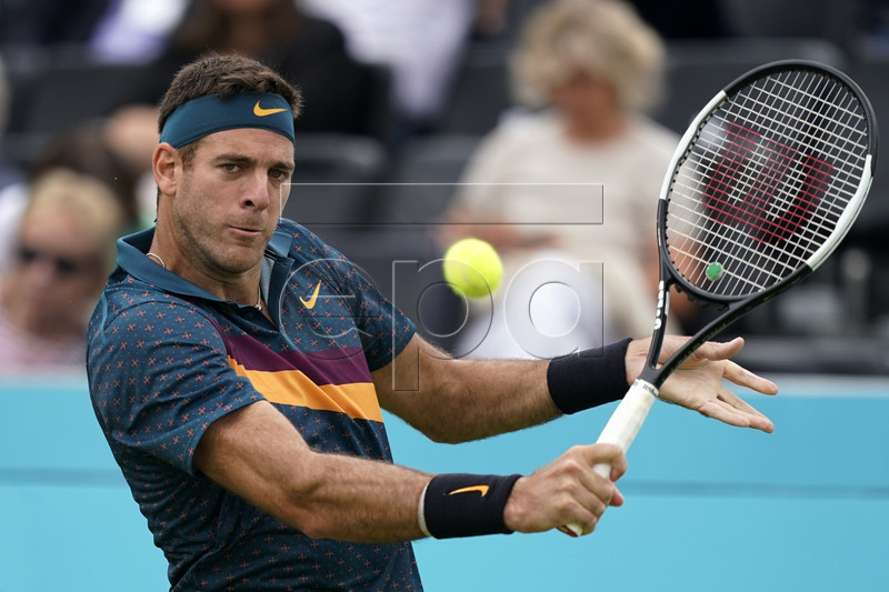 Argentina's Juan Martin del Potro serves to Canada's Denis Shapovalov during their round 32 match at the Fever Tree Championship at Queen's Club in London, Britain, 19 June 2019. The tournament runs from 17th June till 23 June 2019. EPA-EFE/WILL OLIVER