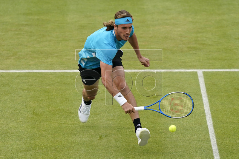 Stefanos Tsitsipas of Greece returns to Britain's Kyle Edmund during their round 32 match at the Fever Tree Championship at Queen's Club in London, Britain, 19 June 2019. EPA-EFE/WILL OLIVER