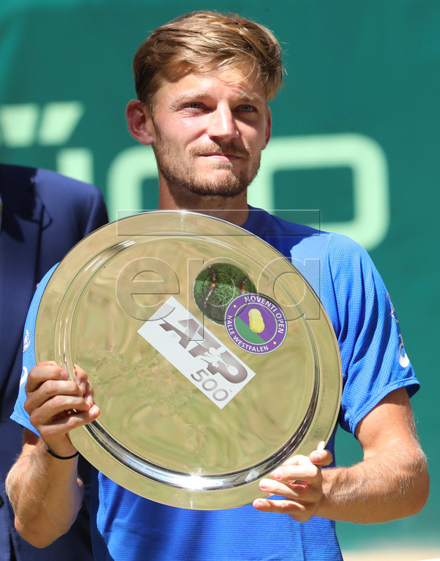 David Goffin from Belgium poses with the runner-up trophy after the final match against Roger Federer from Switzerland at the ATP Tennis Tournament Noventi Open (former Gerry Weber Open) in Halle Westphalia, Germany, 23 June 2019. EPA-EFE/FOCKE STRANGMANN