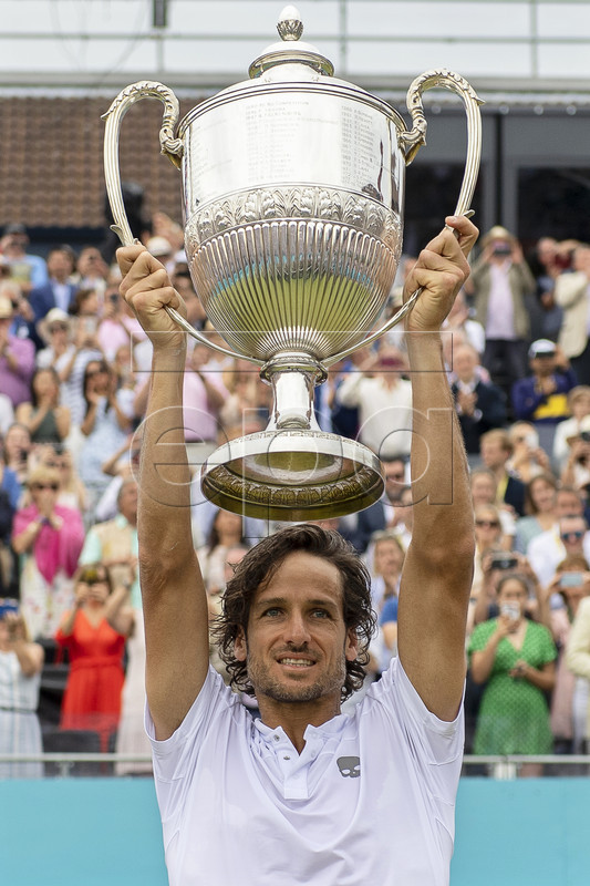 Spain's Feliciano Lopez lifts his trophy after defeating Gilles Simon of France in their final match at the Fever Tree Championship at Queen's Club in London, Britain, 23 June 2019. EPA-EFE/WILL OLIVER