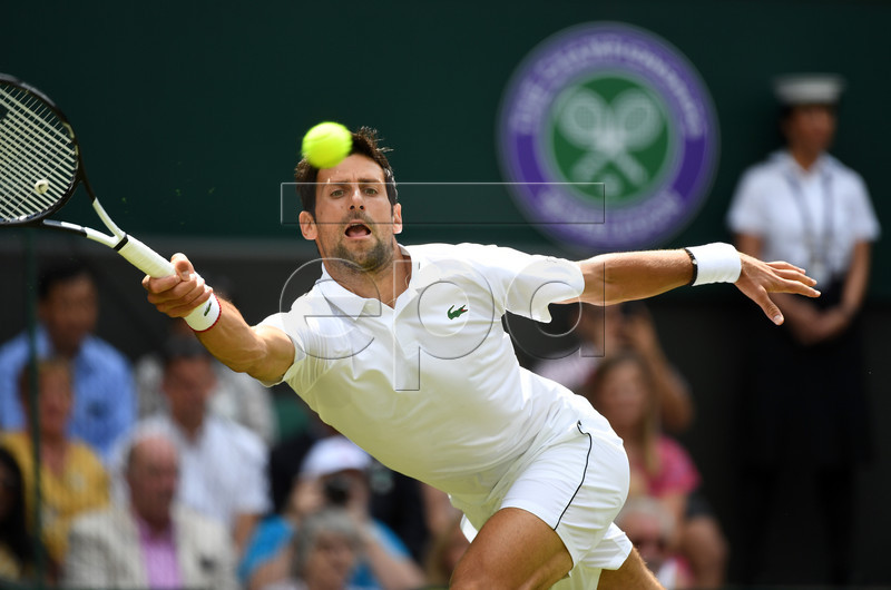 Novak Djokovic of Serbia returns to Philipp Kohlschreiber of Germany in their first round match during the Wimbledon Championships at the All England Lawn Tennis Club, in London, Britain, 01 July 2019. EPA-EFE/ANDY RAIN EDITORIAL USE ONLY/NO COMMERCIAL SALES