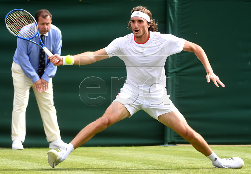 Stefanos Tsitsipas of Greece in action against Thomas Fabbiano of Italy during their first round match at the Wimbledon Championships at the All England Lawn Tennis Club, in London, Britain, 01 July 2019. EPA-EFE/FACUNDO ARRIZABALAGA EDITORIAL USE ONLY/NO COMMERCIAL SALES