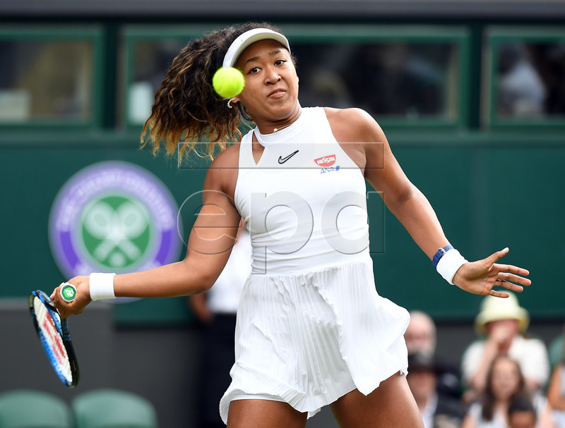 Naomi Osaka of Japan returns to Yulia Putintseva of Kazakhstan in their first round match during the Wimbledon Championships at the All England Lawn Tennis Club, in London, Britain, 01 July 2019. EPA-EFE/ANDY RAIN EDITORIAL USE ONLY/NO COMMERCIAL SALES