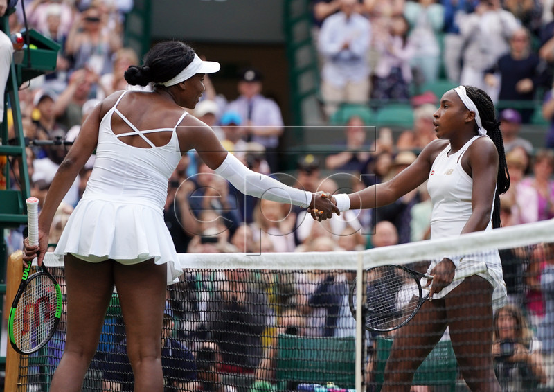Cori Gauff of the US (R) at the net with compatriot Venus Williams whom she defeated in their first round match during the Wimbledon Championships at the All England Lawn Tennis Club, in London, Britain, 01 July 2019. EPA-EFE/NIC BOTHMA EDITORIAL USE ONLY/NO COMMERCIAL SALES