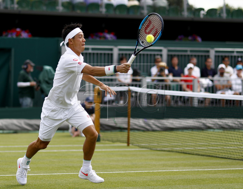 Kei Nishikori of Japan in action against Thiago Monteiro of Brazil during their first round match at the Wimbledon Championships at the All England Lawn Tennis Club, in London, Britain, 02 July 2019. EPA-EFE/NIC BOTHMA EDITORIAL USE ONLY/NO COMMERCIAL SALES