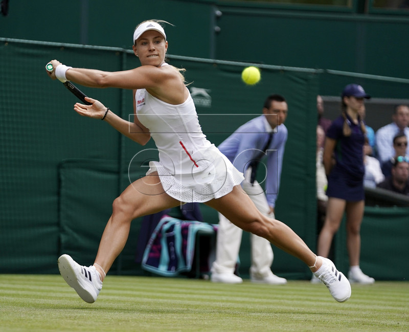 Angelique Kerber of Germany returns to compatriot Tatjana Maria in their first round match during the Wimbledon Championships at the All England Lawn Tennis Club, in London, Britain, 02 July 2019. EPA-EFE/WILL OLIVER EDITORIAL USE ONLY/NO COMMERCIAL SALES
