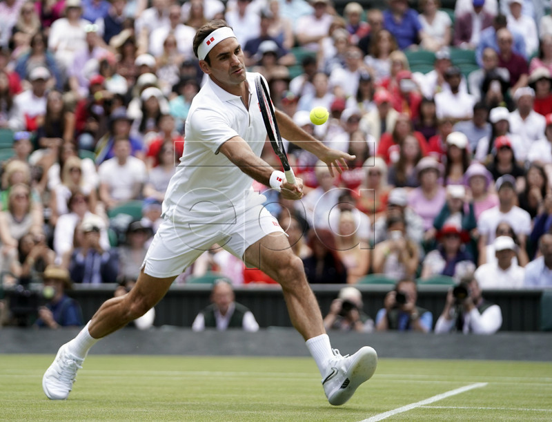 Roger Federer of Switzerland returns to Lloyd Harris of South Africa during the Wimbledon Championships at the All England Lawn Tennis Club, in London, Britain, 02 July 2019. EPA-EFE/WILL OLIVER EDITORIAL USE ONLY/NO COMMERCIAL SALES