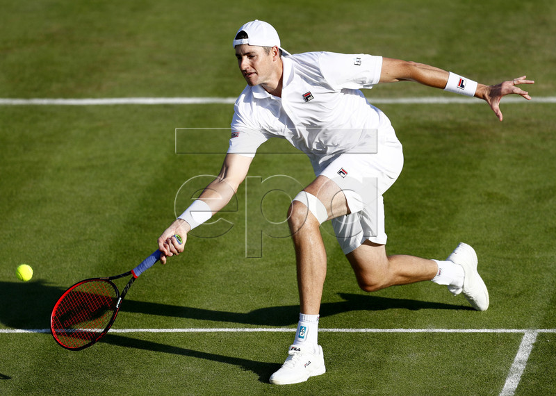 John Isner of the USA in action against Casper Ruud of Norway during their first round match at the Wimbledon Championships at the All England Lawn Tennis Club, in London, Britain, 02 July 2019. EPA-EFE/NIC BOTHMA EDITORIAL USE ONLY/NO COMMERCIAL SALES