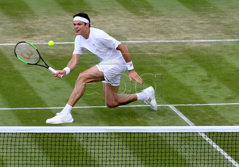 Milos Raonic of Canada in action against Robin Haase of the Netherlands during their second round match at the Wimbledon Championships at the All England Lawn Tennis Club, in London, Britain, 03 July 2019. EPA-EFE/FACUNDO ARRIZABALAGA EDITORIAL USE ONLY/NO COMMERCIAL SALES