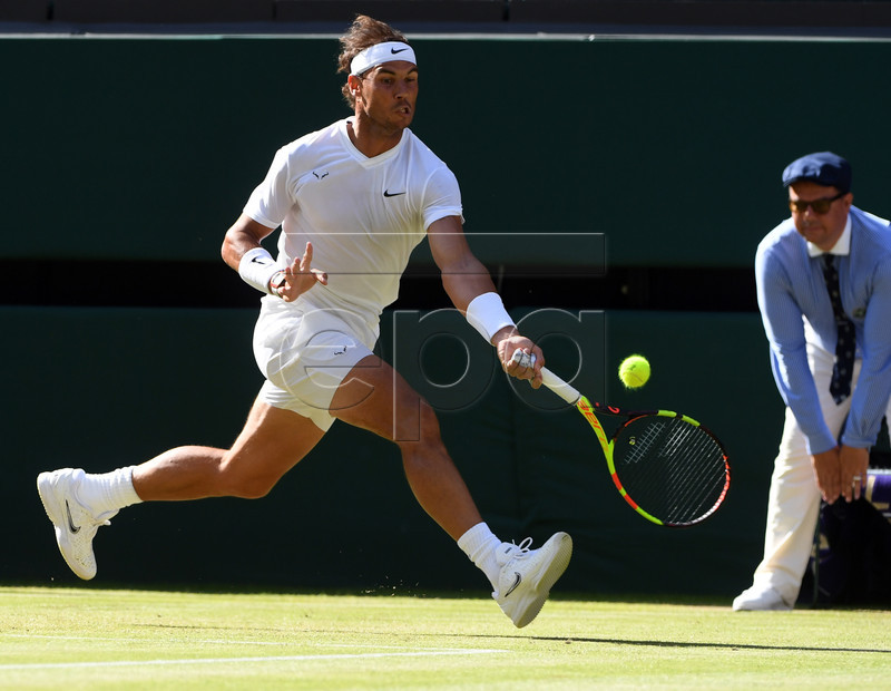 Rafael Nadal of Spain returns to Nick Kyrgios of Australia in their second round match during the Wimbledon Championships at the All England Lawn Tennis Club, in London, Britain, 04 July 2019. EPA-EFE/FACUNDO ARRIZABALAGA EDITORIAL USE ONLY/NO COMMERCIAL SALES