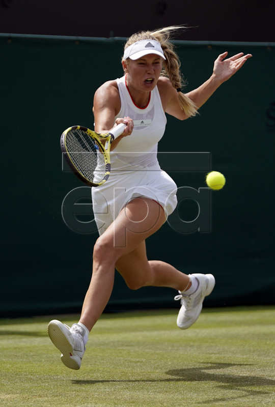 Caroline Wozniacki of Denmark returns to Shuai Zhang of China in their third round match during the Wimbledon Championships at the All England Lawn Tennis Club, in London, Britain, 05 July 2019. EPA-EFE/WILL OLIVER EDITORIAL USE ONLY/NO COMMERCIAL SALES