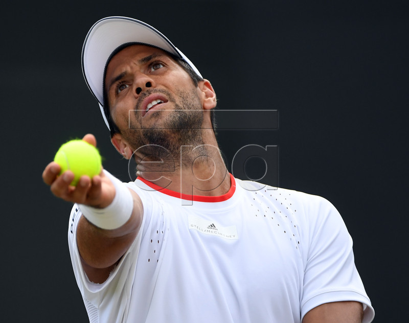 Fernando Verdasco of Spain serves to Thomas Fabbiano of Italy in their third round match during the Wimbledon Championships at the All England Lawn Tennis Club, in London, Britain, 05 July 2019. EPA-EFE/FACUNDO ARRIZABALAGA EDITORIAL USE ONLY/NO COMMERCIAL SALES