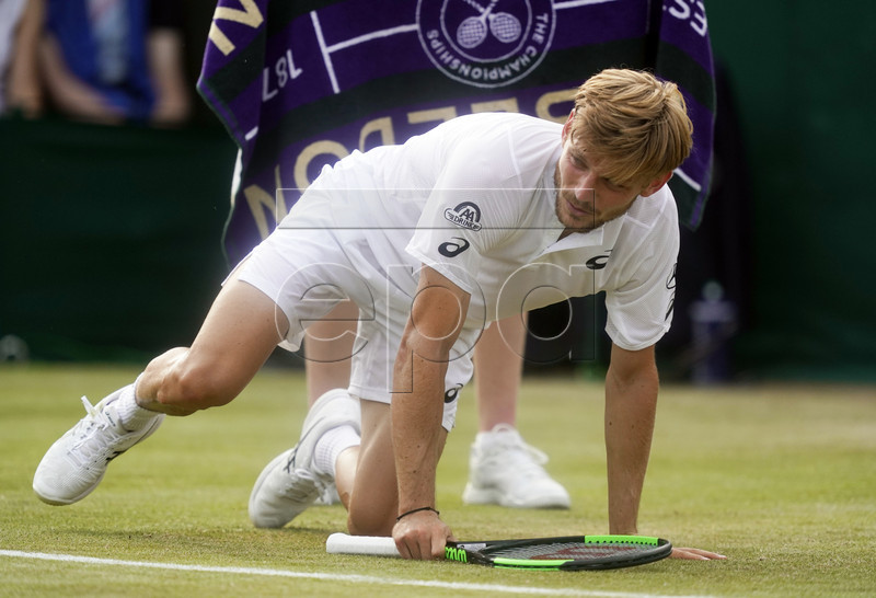 David Goffin of Belgium takes a fall as he plays Daniil Medvedev of Russia in their third round match during the Wimbledon Championships at the All England Lawn Tennis Club, in London, Britain, 05 July 2019. EPA-EFE/WILL OLIVER EDITORIAL USE ONLY/NO COMMERCIAL SALES