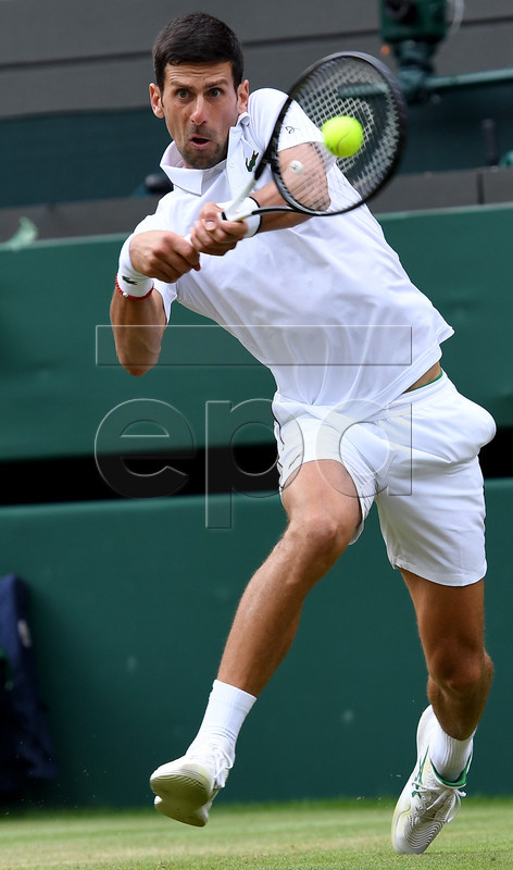 Novak Djokovic of Serbia in action against Ugo Humbert of France during their fourth round match for the Wimbledon Championships at the All England Lawn Tennis Club, in London, Britain, 08 July 2019. EPA-EFE/ANDY RAIN EDITORIAL USE ONLY/NO COMMERCIAL SALES