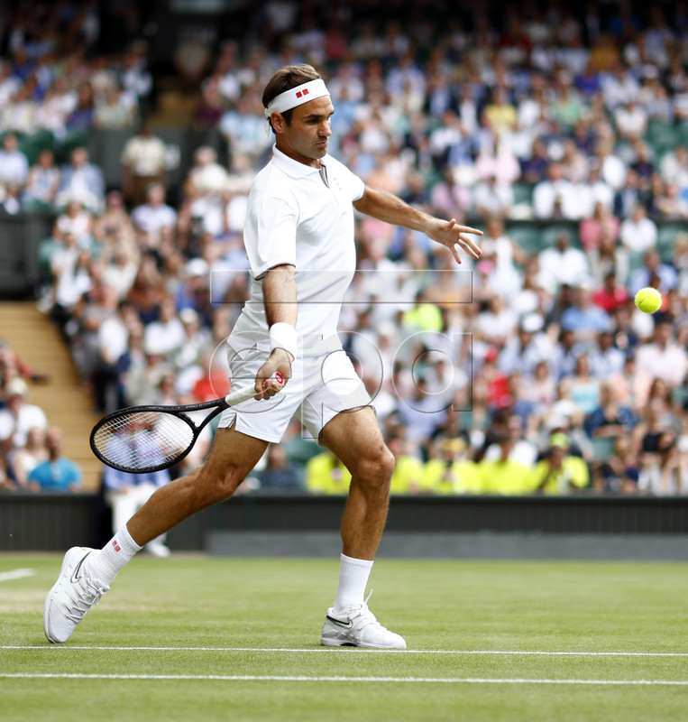 Roger Federer of Switzerland returns to Matteo Berrettini of Italy in their fourth round match during the Wimbledon Championships at the All England Lawn Tennis Club, in London, Britain, 08 July 2019. EPA-EFE/NIC BOTHMA EDITORIAL USE ONLY/NO COMMERCIAL SALES