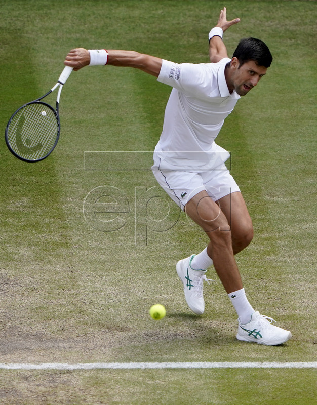 Novak Djokovic of Serbia in action against David Goffin of Belgium during their quarter final match for the Wimbledon Championships at the All England Lawn Tennis Club, in London, Britain, 10 July 2019. EPA-EFE/NIC BOTHMA EDITORIAL USE ONLY/NO COMMERCIAL SALES