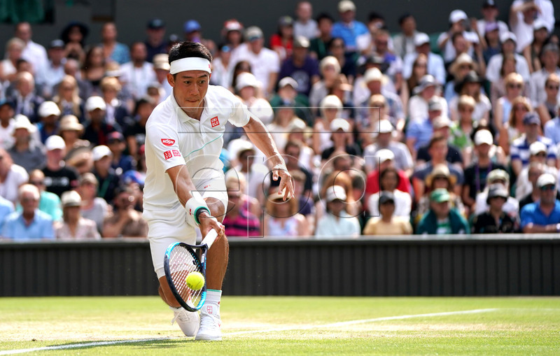 Kei Nishikori of Japan in action against Roger Federer of Switzerland during their quarter final match for the Wimbledon Championships at the All England Lawn Tennis Club, in London, Britain, 10 July 2019. EPA-EFE/NIC BOTHMA EDITORIAL USE ONLY/NO COMMERCIAL SALES