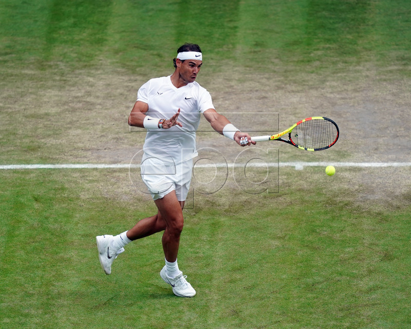 Rafael Nadal of Spain returns to Sam Querrey of the US in their quarter final match during the Wimbledon Championships at the All England Lawn Tennis Club, in London, Britain, 10 July 2019. EPA-EFE/WILL OLIVER EDITORIAL USE ONLY/NO COMMERCIAL SALES