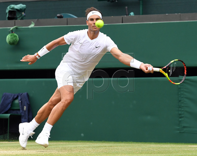 Rafael Nadal of Spain returns to Sam Querrey of the US in their quarter final match during the Wimbledon Championships at the All England Lawn Tennis Club, in London, Britain, 10 July 2019. EPA-EFE/FACUNDO ARRIZABALAGA EDITORIAL USE ONLY/NO COMMERCIAL SALES