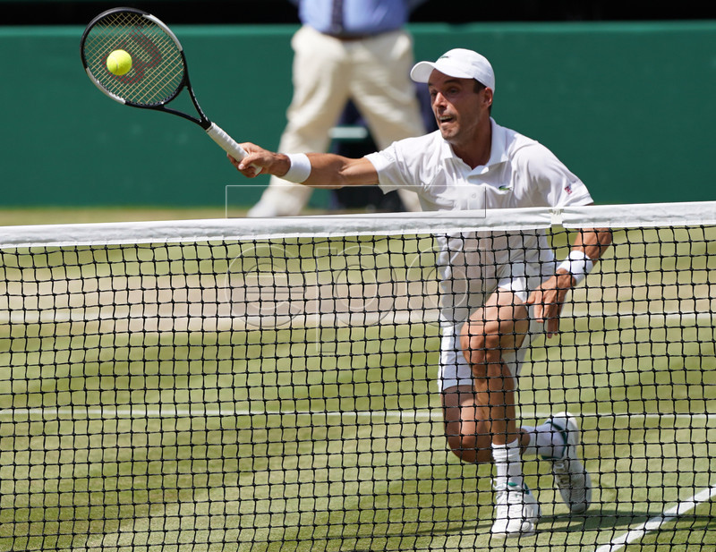 Roberto Bautista Agut of Spain returns to Novak Djokovic of Serbia in their semi final match during the Wimbledon Championships at the All England Lawn Tennis Club, in London, Britain, 12 July 2019. EPA-EFE/NIC BOTHMA EDITORIAL USE ONLY/NO COMMERCIAL SALES