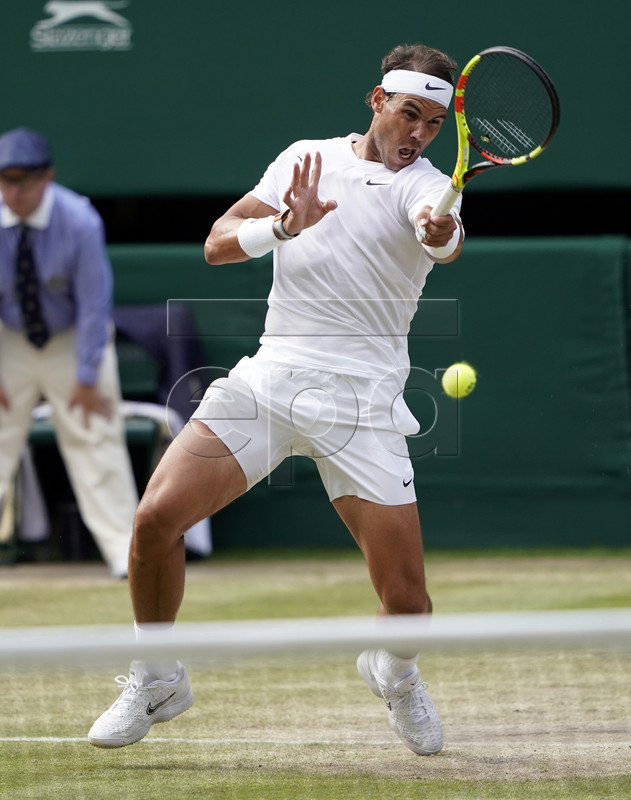 Rafael Nadal of Spain returns to Roger Federer of Switzerland in their semi final match during the Wimbledon Championships at the All England Lawn Tennis Club, in London, Britain, 12 July 2019. EPA-EFE/NIC BOTHMA EDITORIAL USE ONLY/NO COMMERCIAL SALES