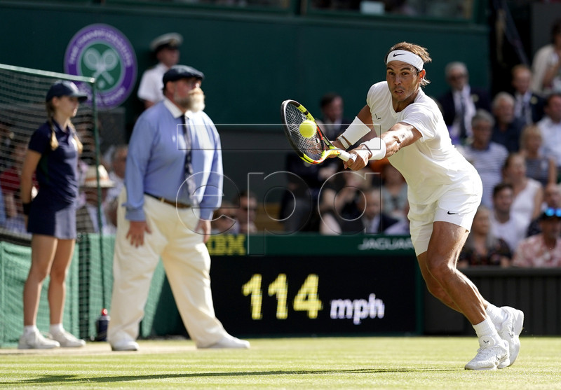 Rafael Nadal of Spain in action against Roger Federer of Switzerland during their semi final match for the Wimbledon Championships at the All England Lawn Tennis Club, in London, Britain, 12 July 2019. EPA-EFE/WILL OLIVER EDITORIAL USE ONLY/NO COMMERCIAL SALES