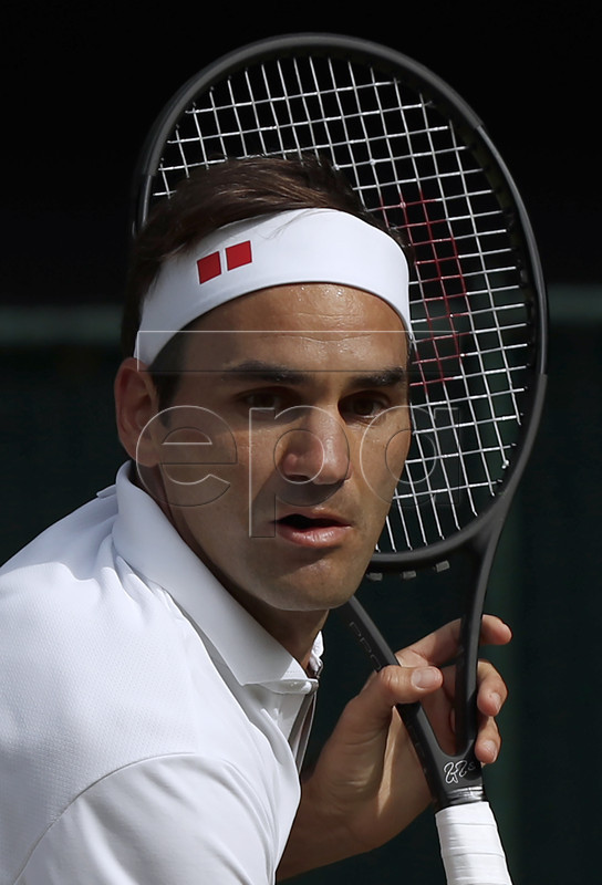 Roger Federer of Switzerland in action against Novak Djokovic of Serbia during their Men's final match for the Wimbledon Championships at the All England Lawn Tennis Club, in London, Britain, 14 July 2019. EPA-EFE/ADRIAN DENNIS / POOL EDITORIAL USE ONLY/NO COMMERCIAL SALES