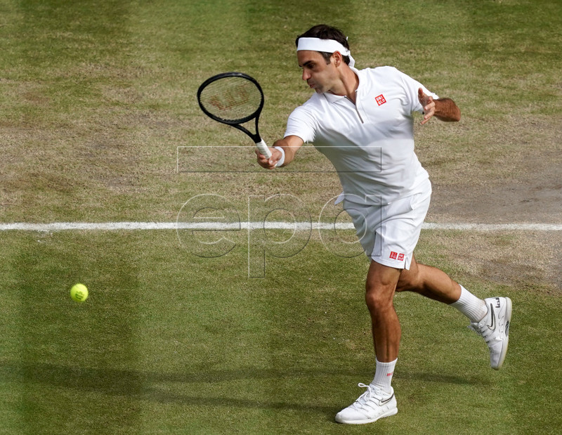 Roger Federer of Switzerland in action against Novak Djokovic of Serbia during their Men's final match for the Wimbledon Championships at the All England Lawn Tennis Club, in London, Britain, 14 July 2019. EPA-EFE/WILL OLIVER EDITORIAL USE ONLY/NO COMMERCIAL SALES